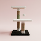 Two-tier cat tree pastel pink background